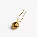 Gold clip-on tea infuser